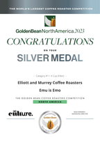 A digital award certificate for the Golden Bean North America 2023 competition, recognizing the Elliott and Murrey Coffee Roasters with a Silver Medal for their Emu coffee. The certificate features a white background with green and gray text, a gold and green logo, and the Cafe Culture logo at the bottom.