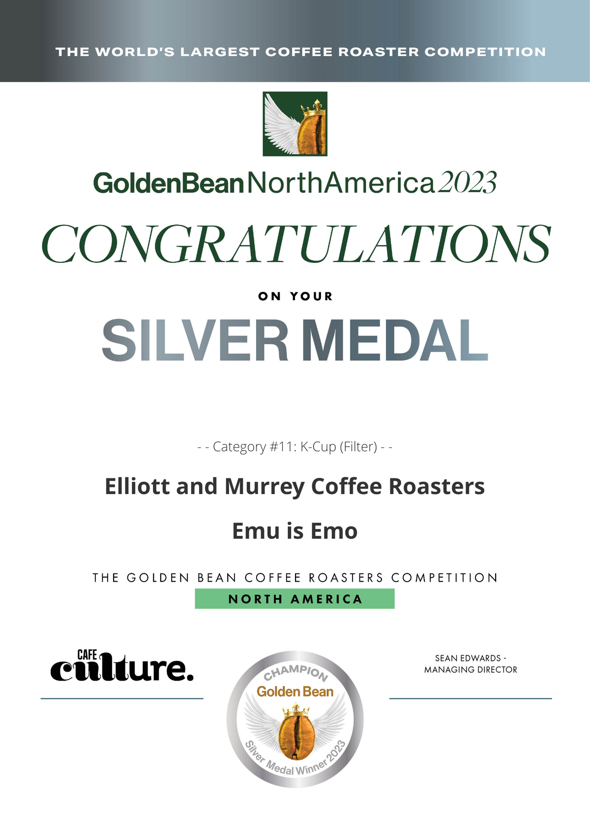 A digital award certificate for the Golden Bean North America 2023 competition, recognizing the Elliott and Murrey Coffee Roasters with a Silver Medal for their Emu coffee. The certificate features a white background with green and gray text, a gold and green logo, and the Cafe Culture logo at the bottom.